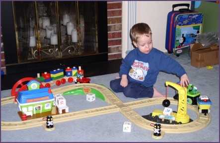 Steven plays with new train set