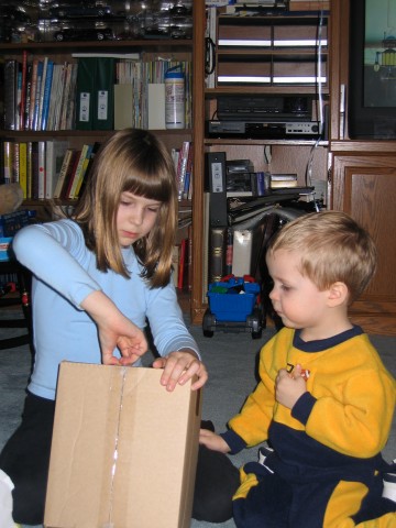 diana helps steven open gifts