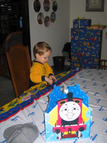 Steven playing trains on the table cloth